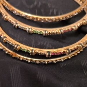 Source Unknown Gold Bangles with Green and Pink Accents